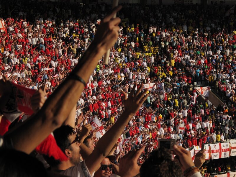 Football fans cheering in stadium