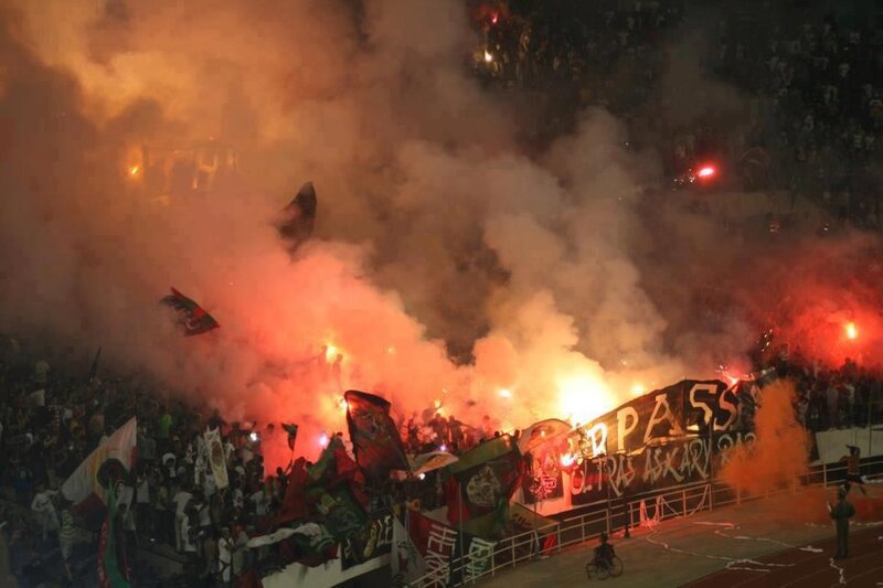 Football fans with flares