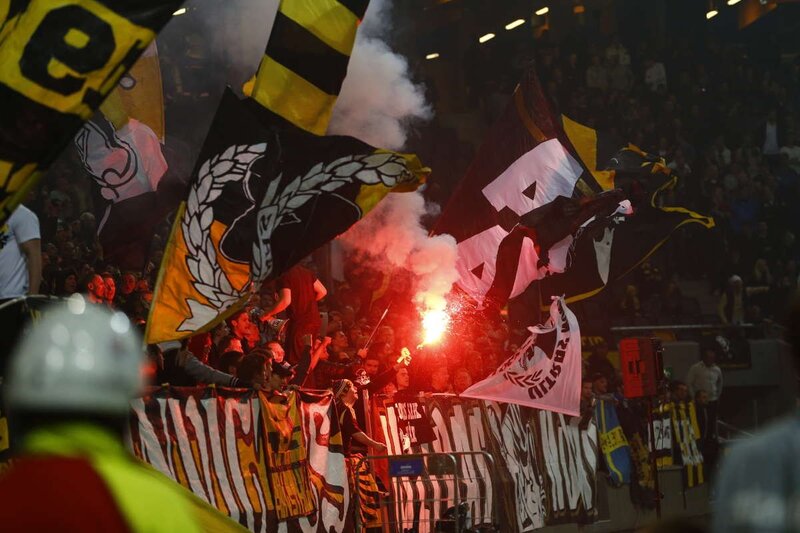 Football fans with flares