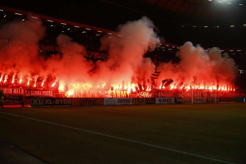 Football fans with flares