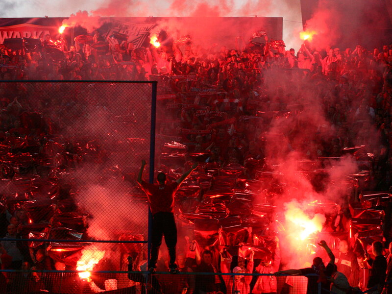 Football fans with flares