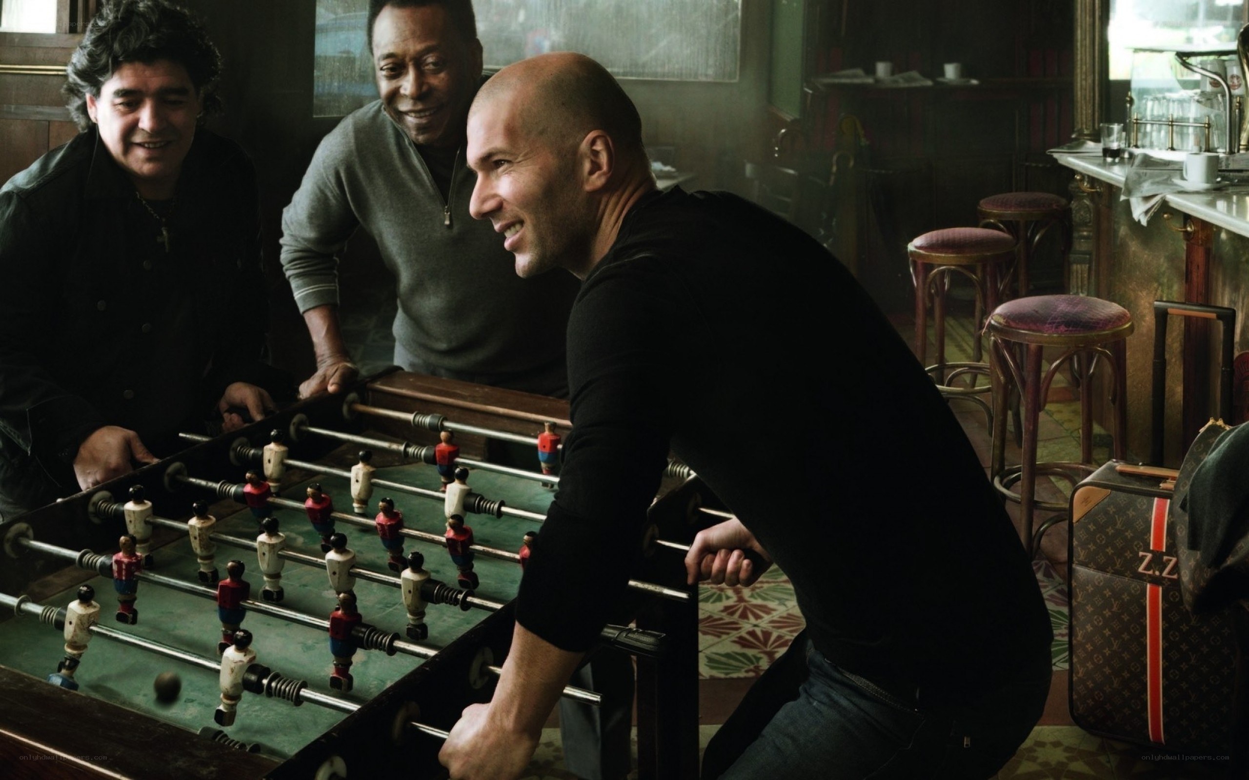 Football legends playing foosball