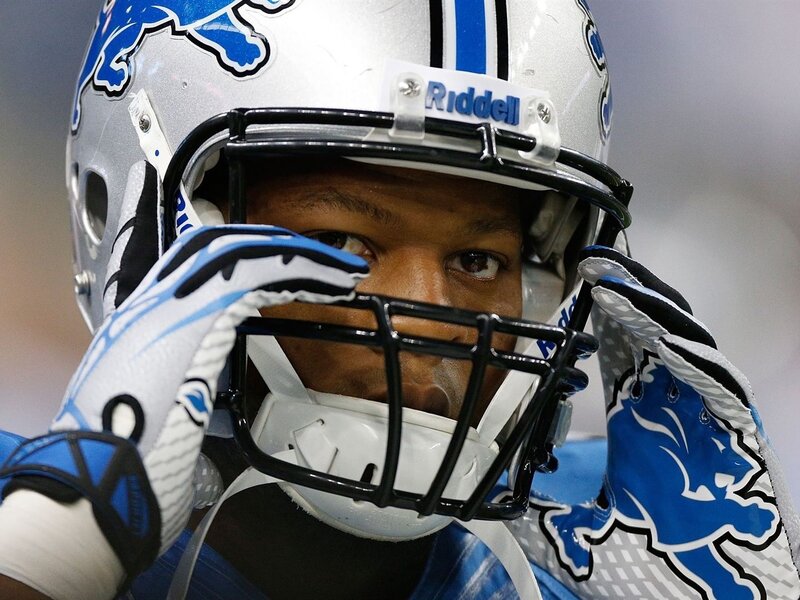 Football Player Adjusting Helmet — Blue