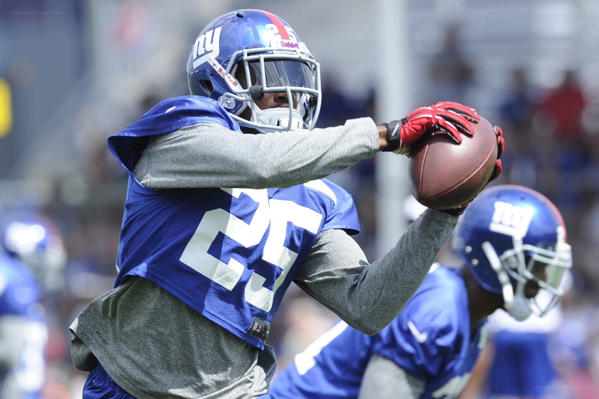 football player catching ball