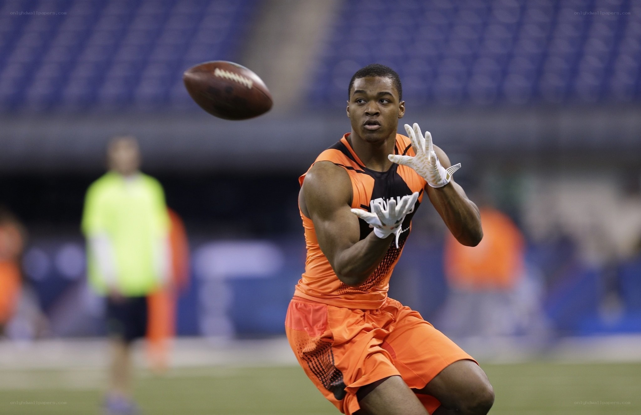 football player catching pass