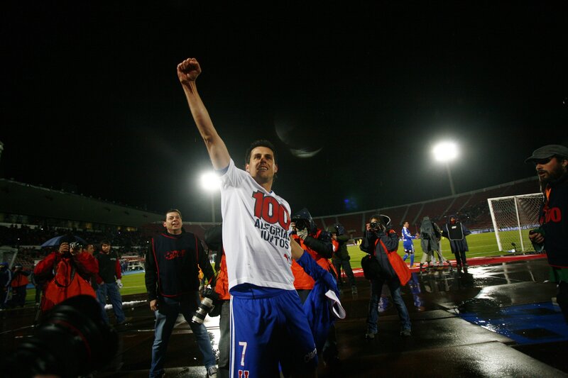 football player celebrates on field