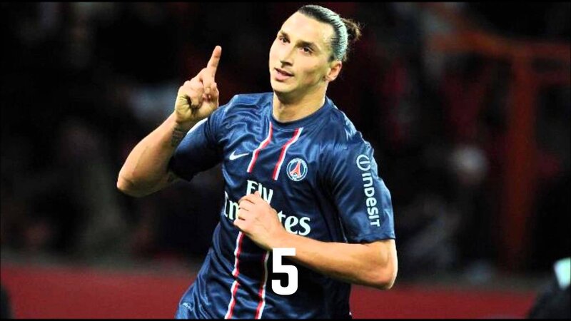 Football Player Celebrating — Blue, Celebratory, Night, Photograph, Jersey, Number