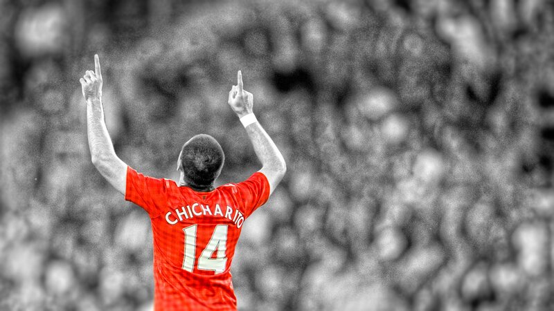 Football Player Celebrating — Red, Celebratory, Photograph, Crowd, Jersey