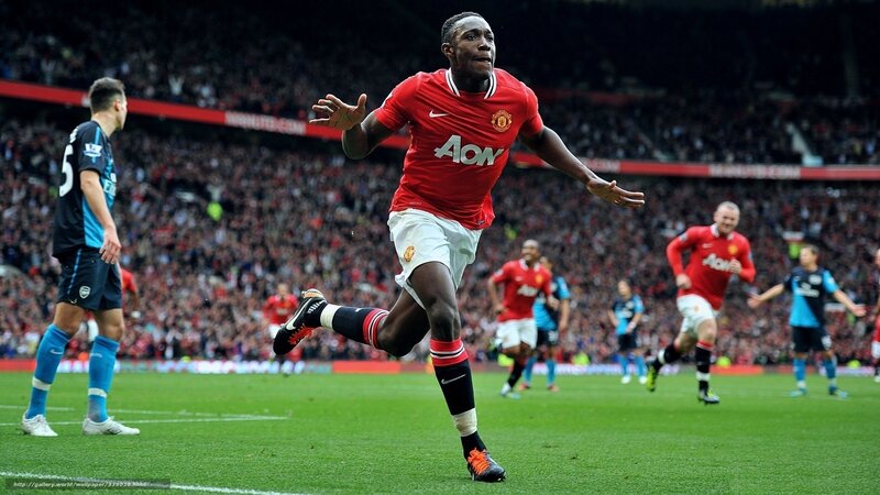 Football Player Celebrating — Red, Energetic, Afternoon, Photograph