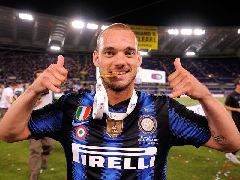 Football player celebrating with medal