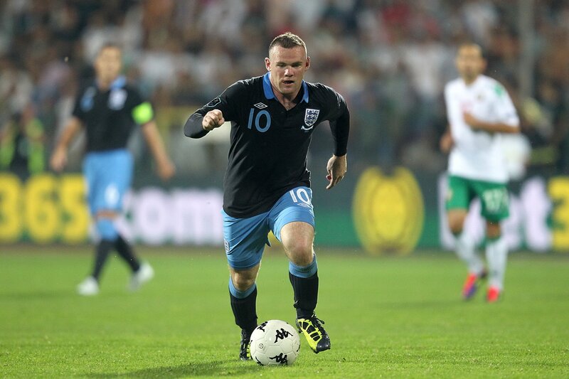 football player dribbling ball