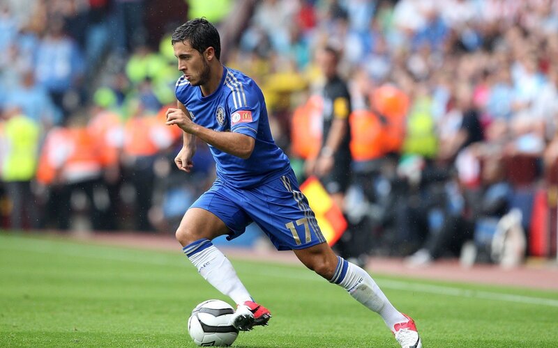 football player dribbling ball