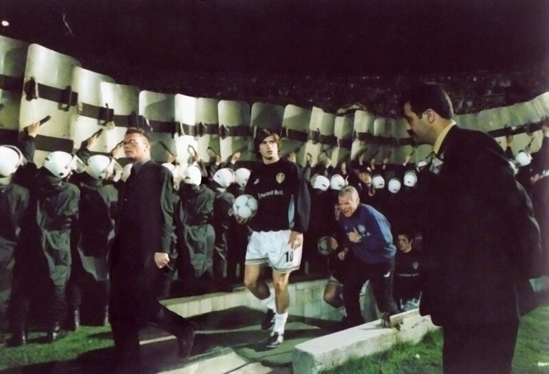 Football player escorted by police