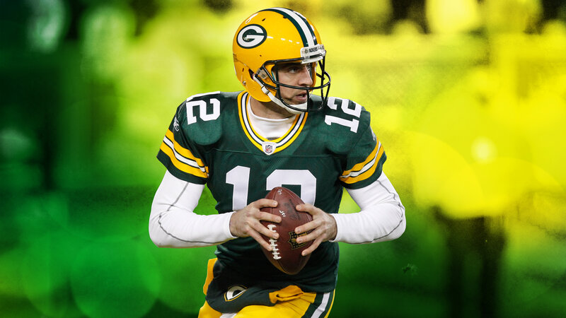 Football Player Holding Ball — Green, Focused