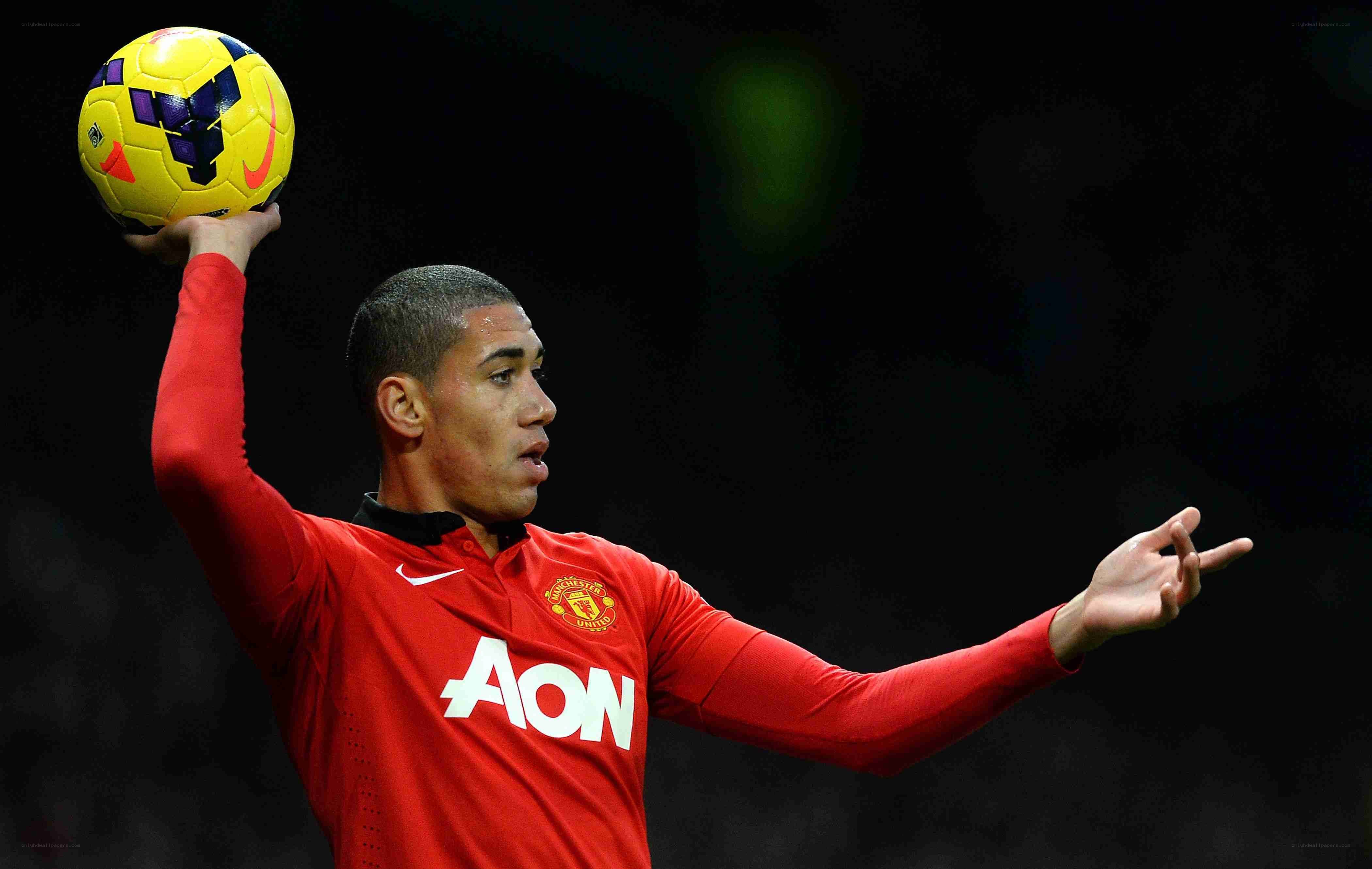 football player holding ball