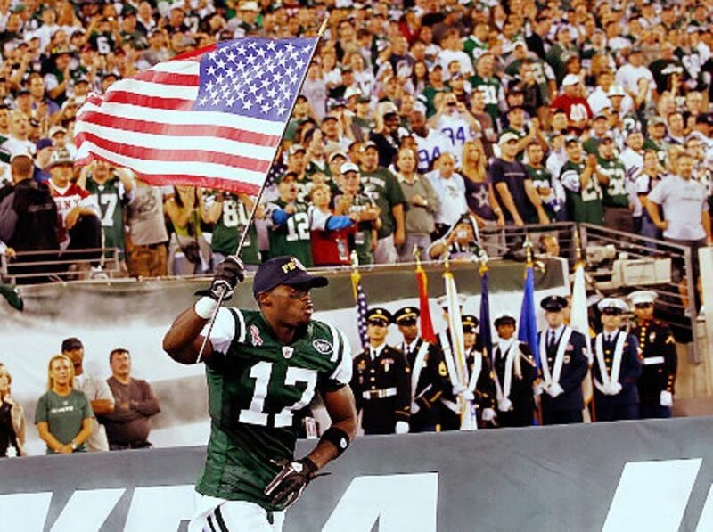 Football Player Holding Flag