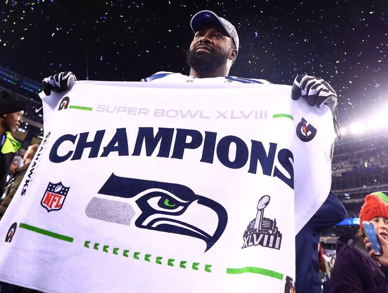 Football Player Holding Towel
