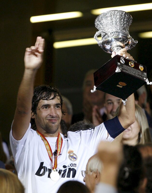 football player holding trophy