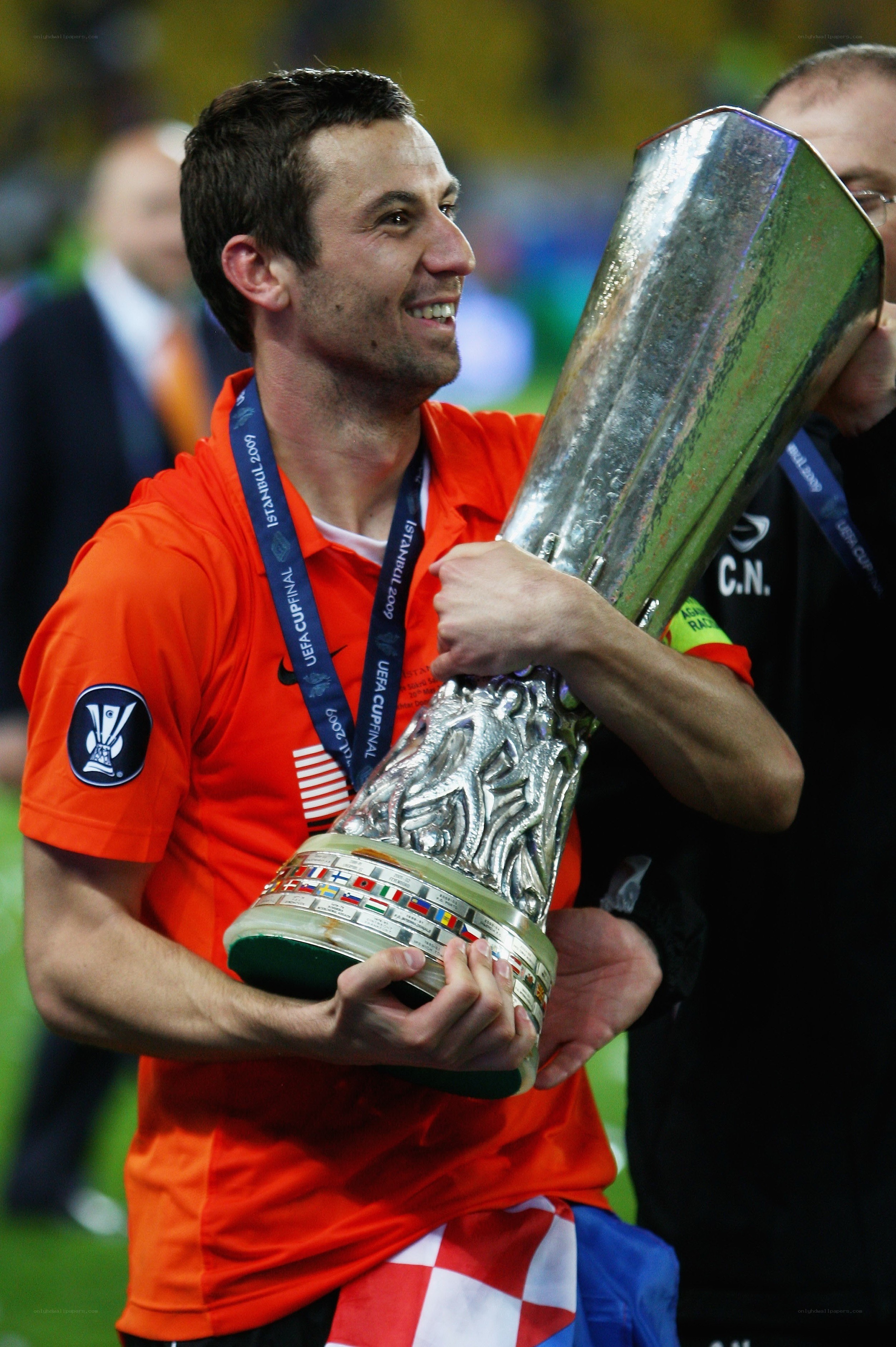 Football player holding trophy