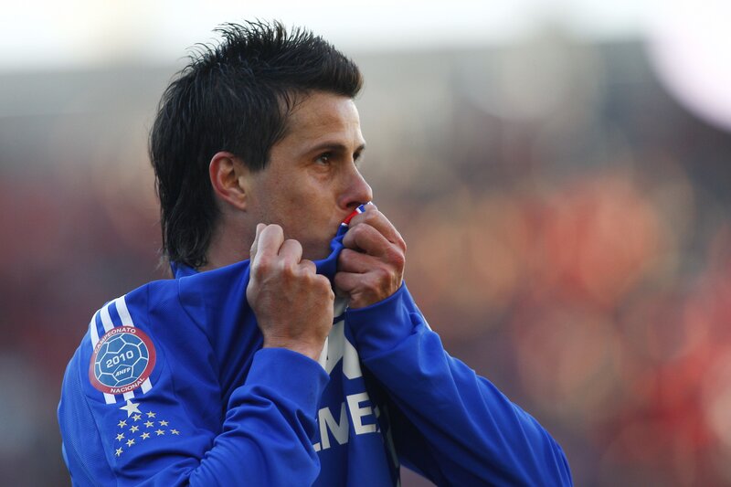 football player in blue jacket