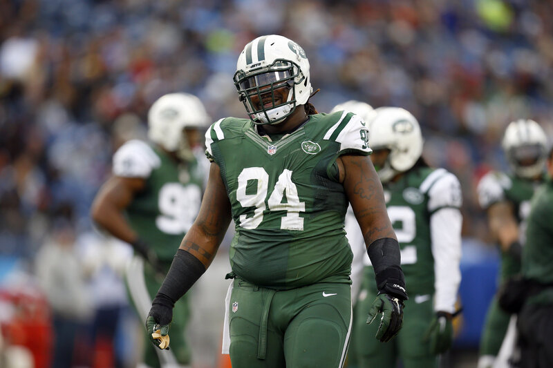 Football Player in Green Uniform