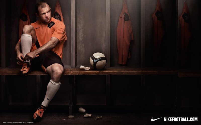 Football Player in Locker Room — Orange