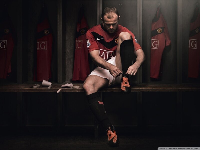 Football Player in Locker Room — Red