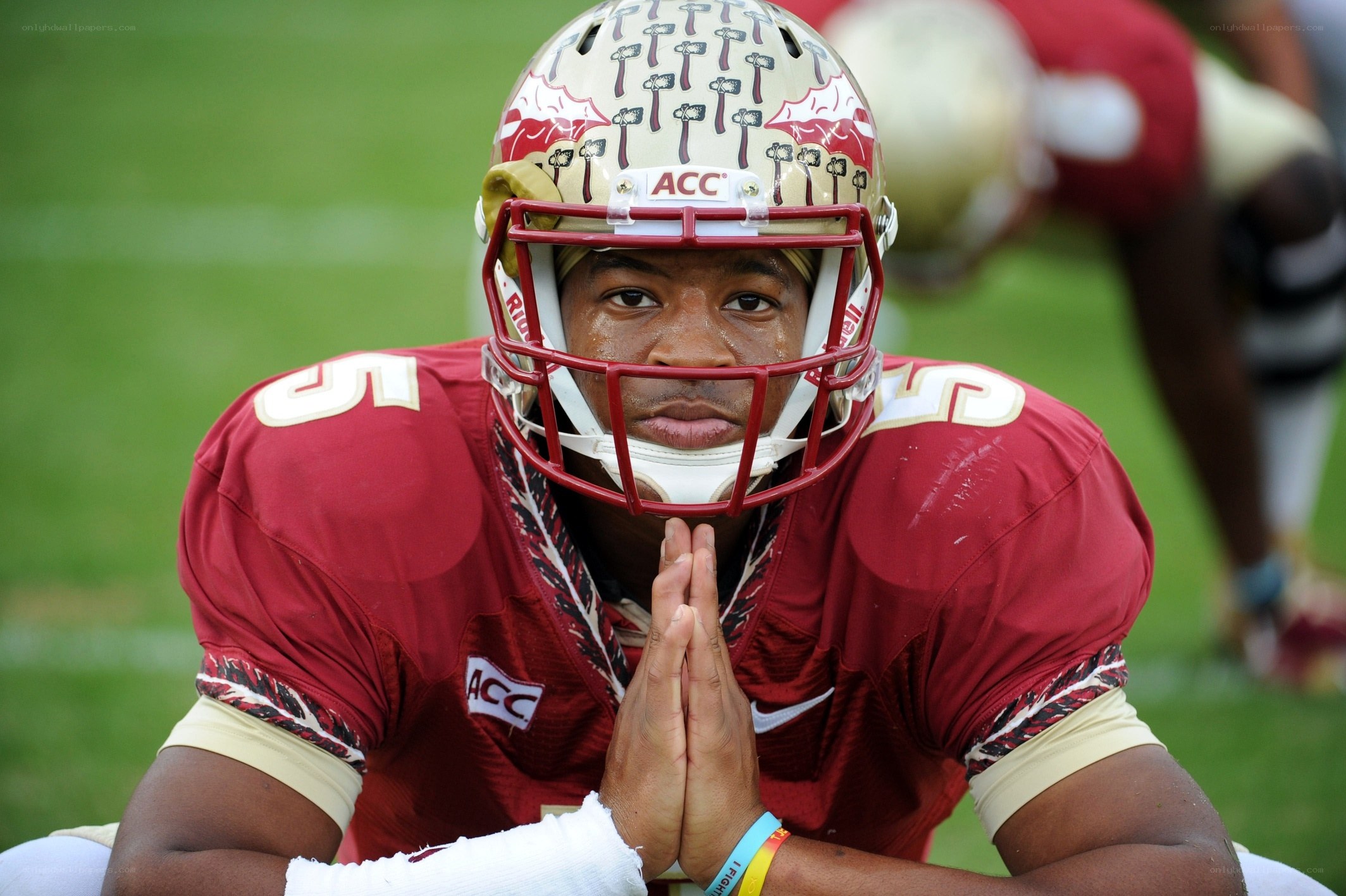 football player in prayer