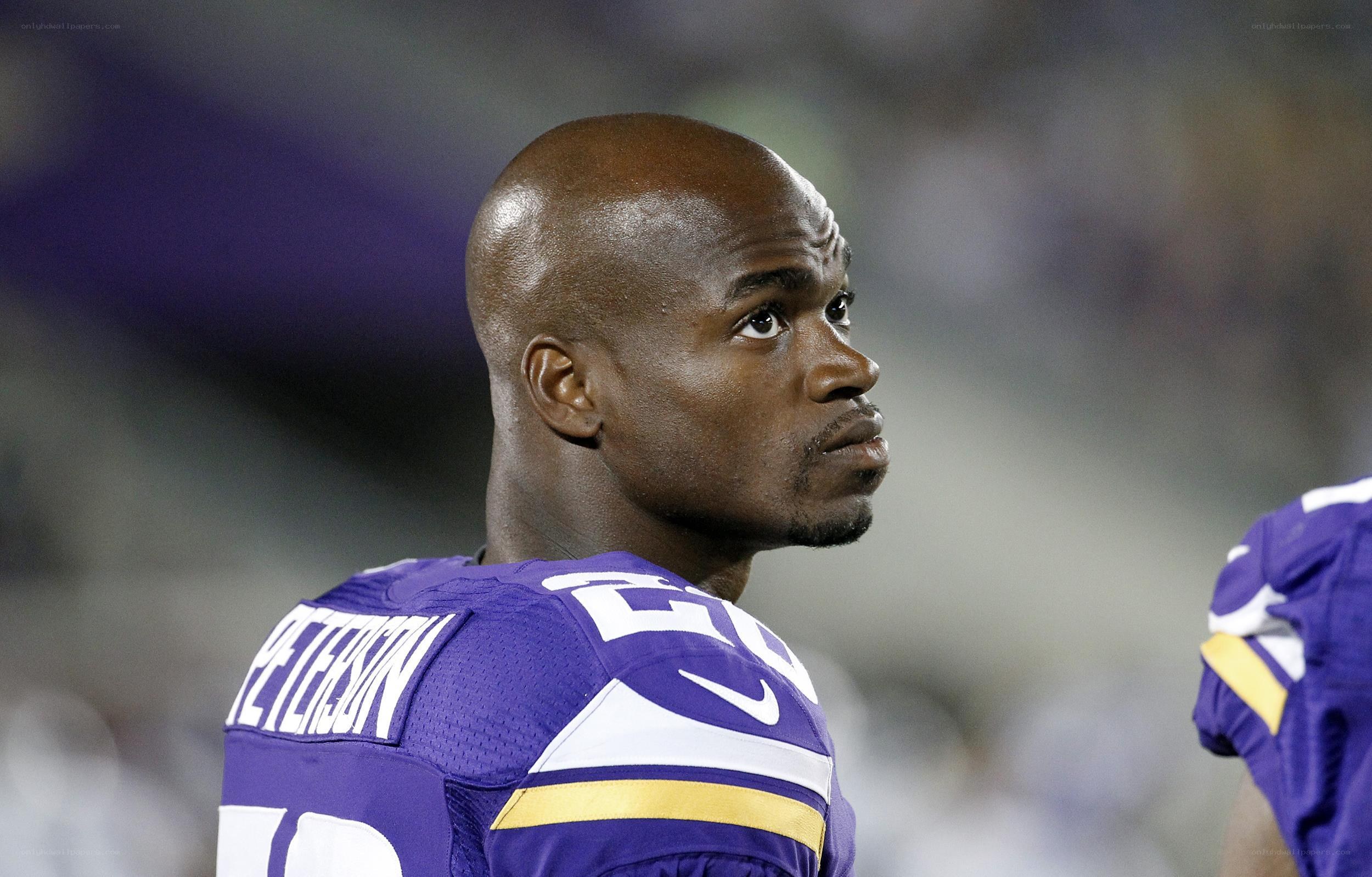 football player in purple uniform