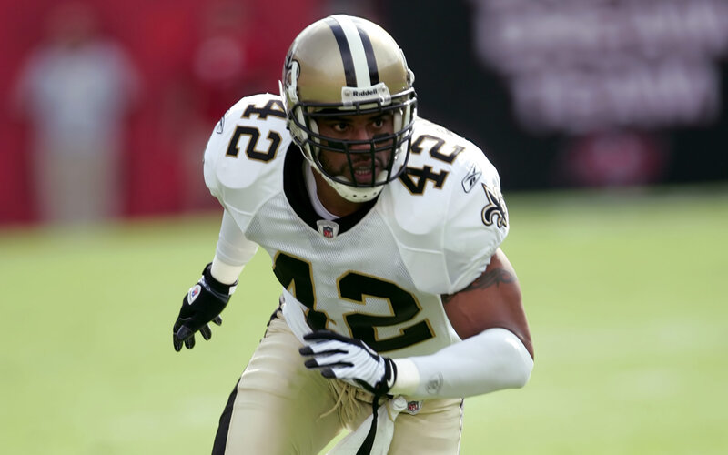 Football Player in Uniform — White, Focused, Afternoon