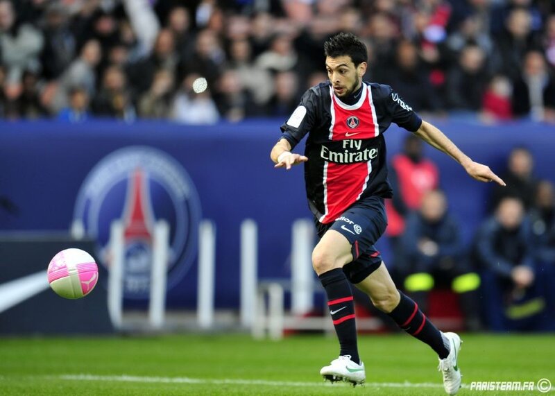 football player kicking ball