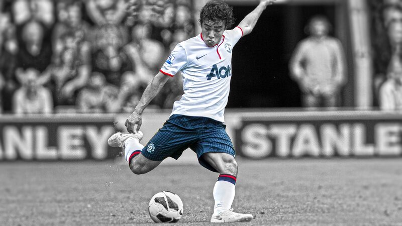 football player kicking ball