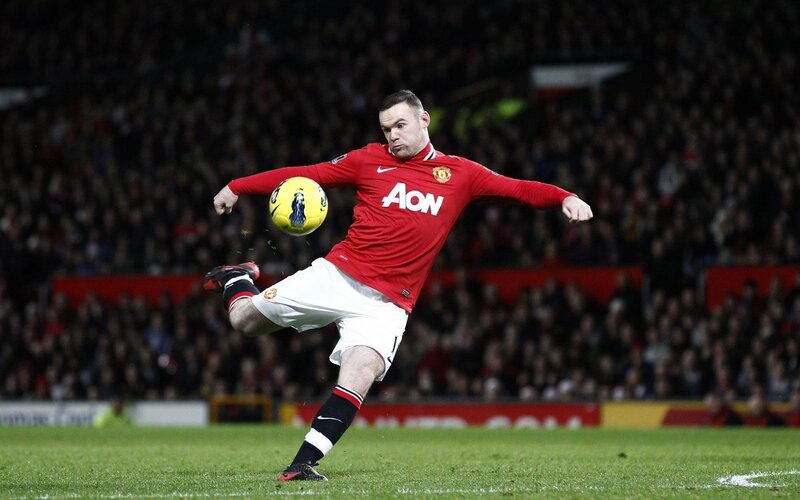 football player kicking ball