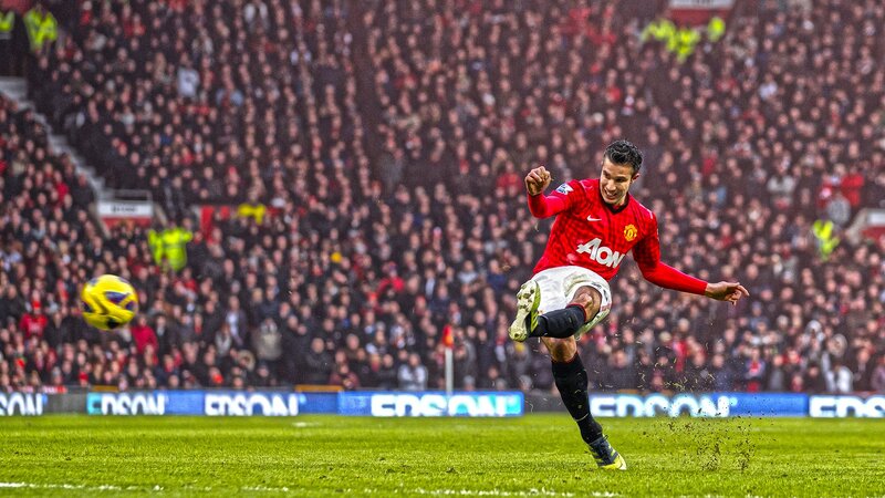 football player kicking ball