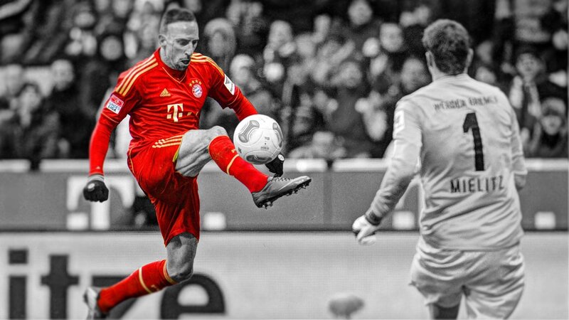 football player kicking ball