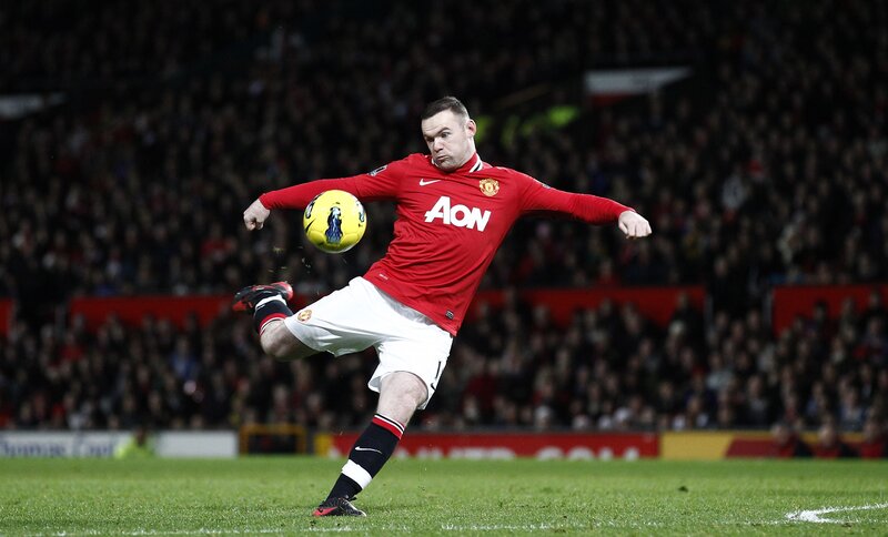football player kicking ball