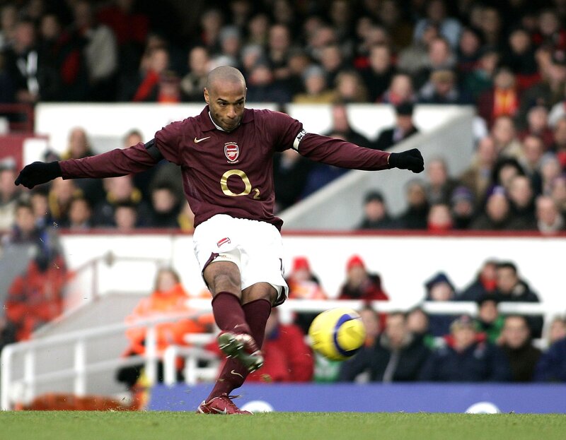 football player kicking ball