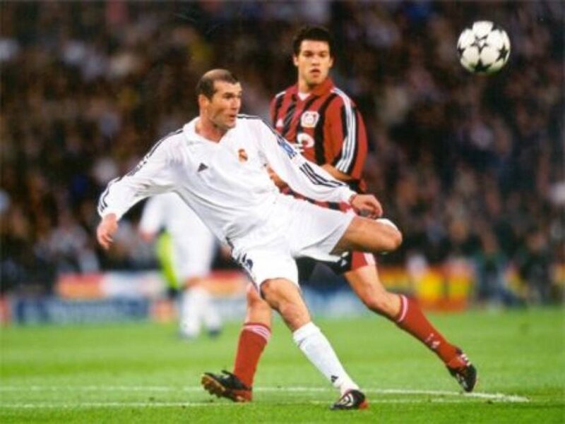 football player kicking ball