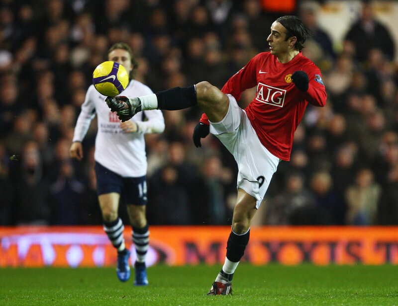 football player kicking ball