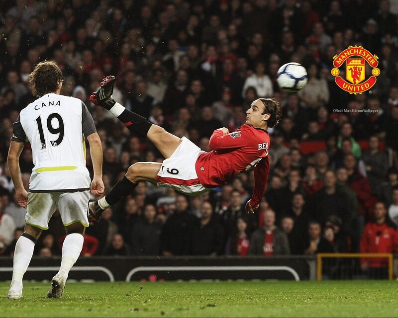 football player kicking ball