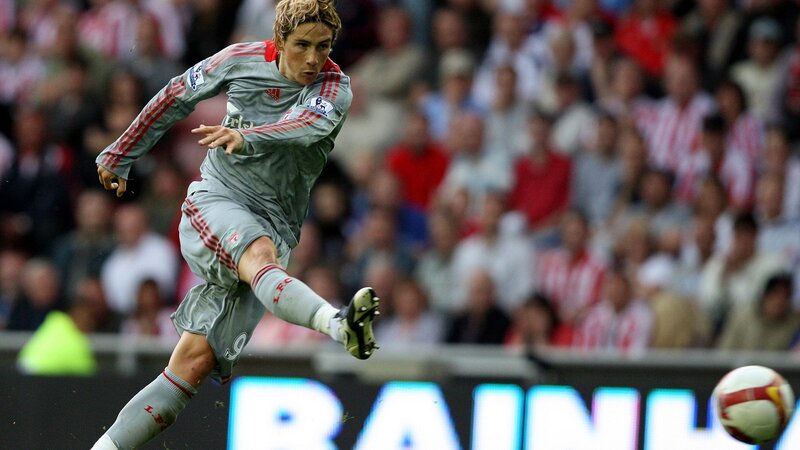 football player kicking ball