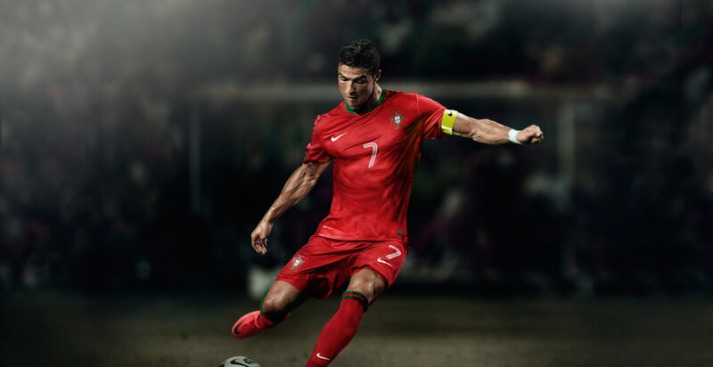 Football Player Kicking Ball — Red, Dramatic, Night, Photograph, Soccer Ball