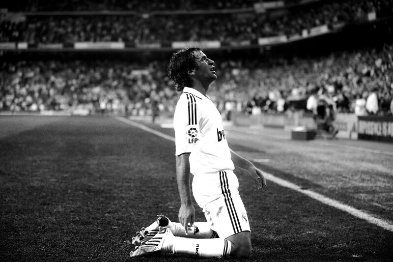 football player kneeling on field
