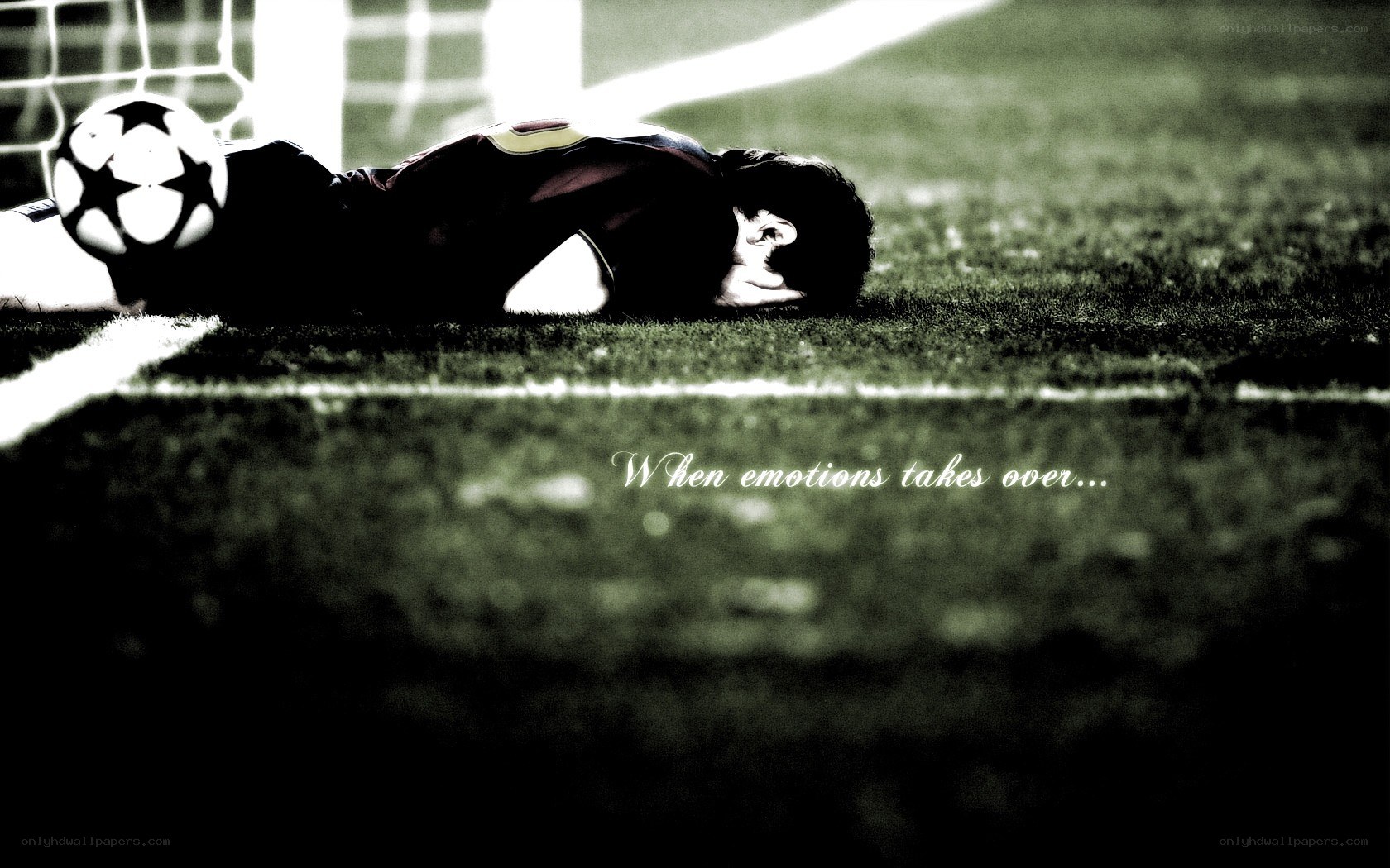football player lying on field