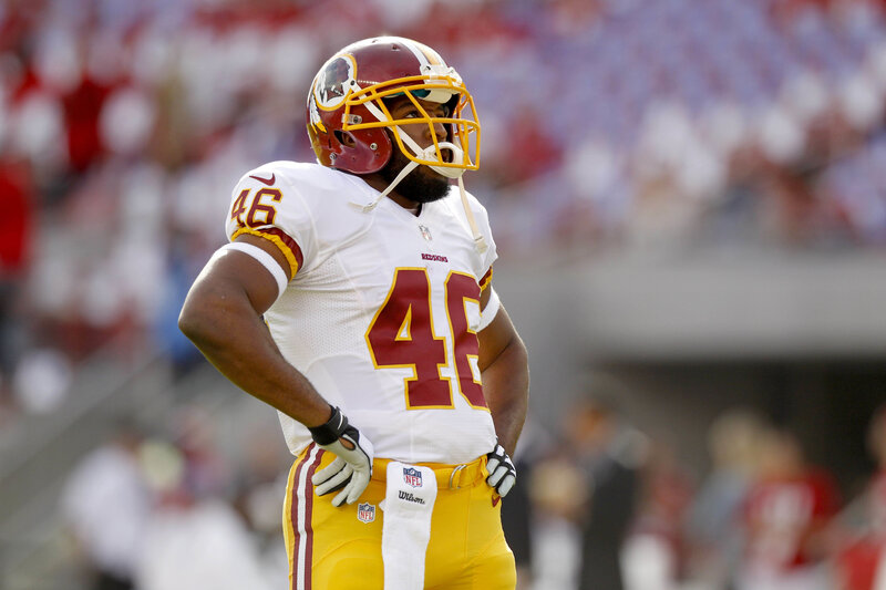 Football Player on Field — White, Focused, Afternoon