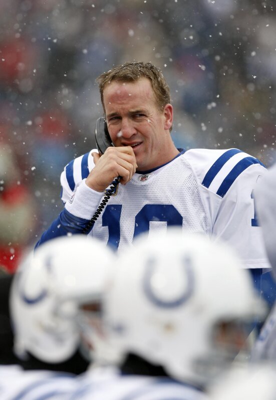 Football player on phone in snow