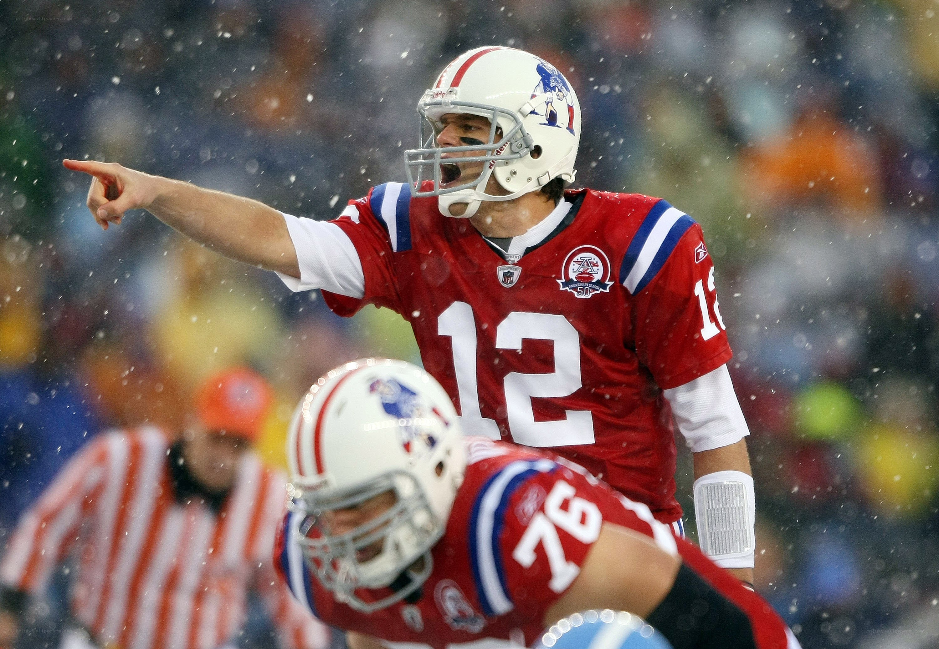 football player pointing in snow