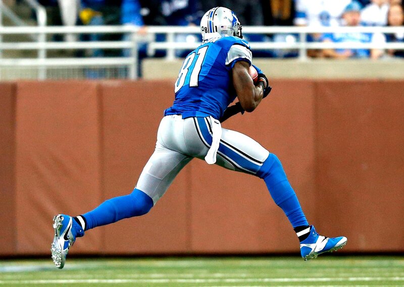 Football Player Running — Blue, Dynamic, Afternoon