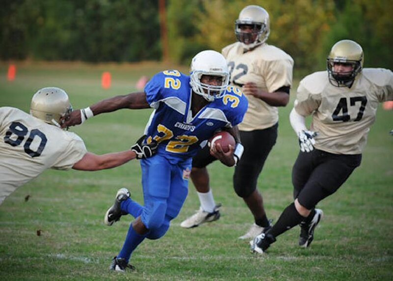 Football player running with ball