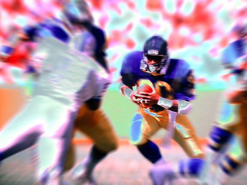 Football player running with ball